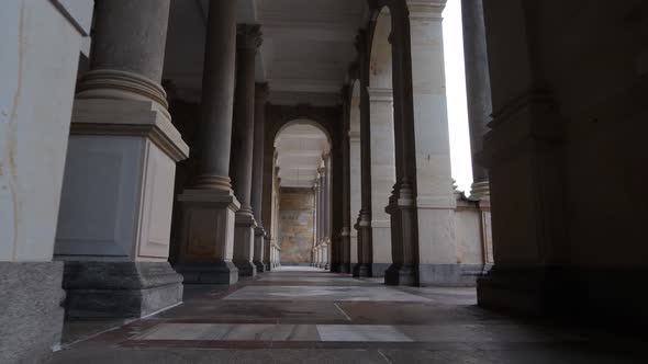 Walking Between Columns in Mill Colonnade, Landmark of Karlovy Vary, Czech Republic, Low Angle View