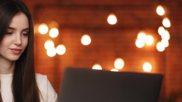 A Woman is Sitting in Her Home Office