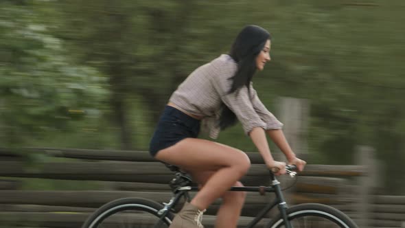 Young Woman Riding a Bicycle Outdoor