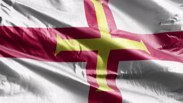 Guernsey textile flag waving on the wind. Slow motion. 20 seconds loop.