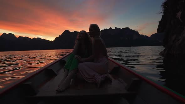 Women and Sunset Cheow Lan Lake