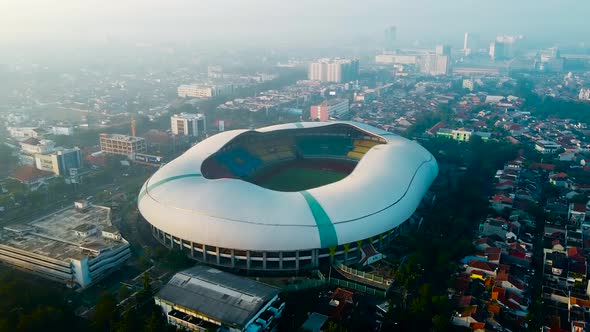 Aerial View - The largest stadium looks from drone. With smog pollution