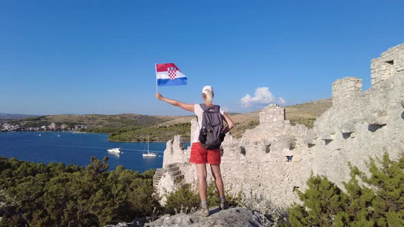 Girl with Croatian Flag on Wall of Ostrica