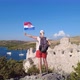 Girl with Croatian Flag on Wall of Ostrica - VideoHive Item for Sale