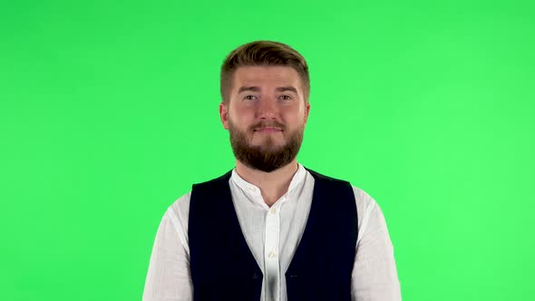 Man Talking and Pointing Side Hand for Something, with Copy Space. Green Screen