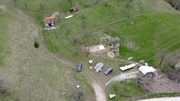 A secluded cabin in the middle of a pasture