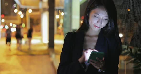 Businesswoman use of mobile phone at outdoor 