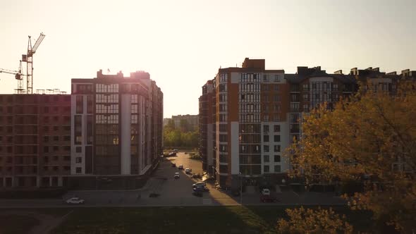 Aerial view of tall residential apartment buildings under construction.