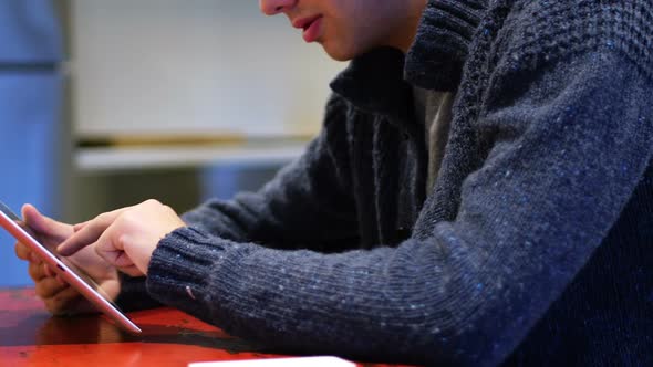 Man using digital tablet