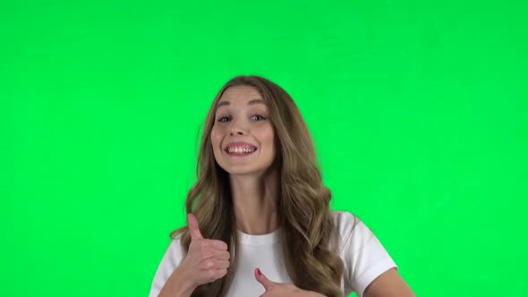 Lovable Girl Showing Thumbs Up, Gesture Like. Green Screen