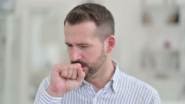 Portrait of Sick Young Man Coughing