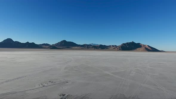 Flying over the Bonneville Salt Flats in Northwestern Utah reveal white salt and tire tracks.