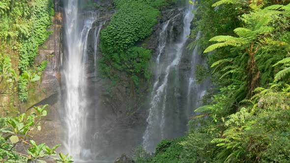 Waterfalls and Green Lush Flora in Bali, Indonesia. Panning Shot, UHD