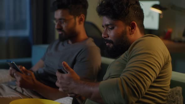 Indian Men Making Online Bets During Match