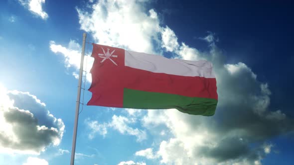 Flag of Oman Waving at Wind Against Beautiful Blue Sky