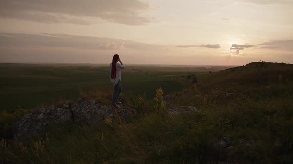 Slow Motion of a Young Girl That Shoots on Her Camera