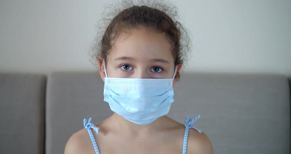 Portrait Cute Child or Little Girl in a Medical Mask