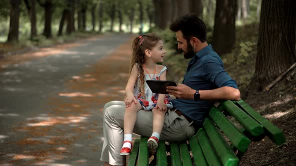 Father's Day. Daughter With Father Learning Tablet Digital Technology. Preschool Girl Tap Pad Screen