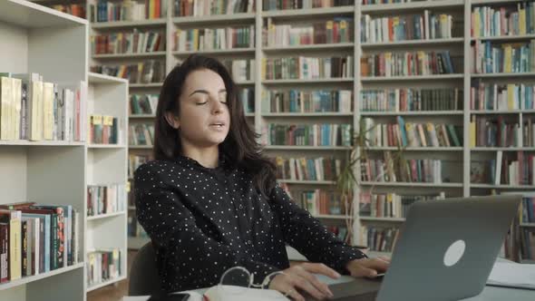 Young Happy Student Relaxing Resting at University or College Library