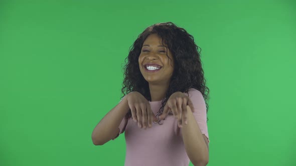 Portrait of Beautiful African American Young Woman Is Looking at Camera and Embarrassed. Burning