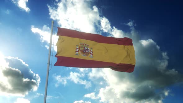 Flag of Spain Waving at Wind Against Beautiful Blue Sky