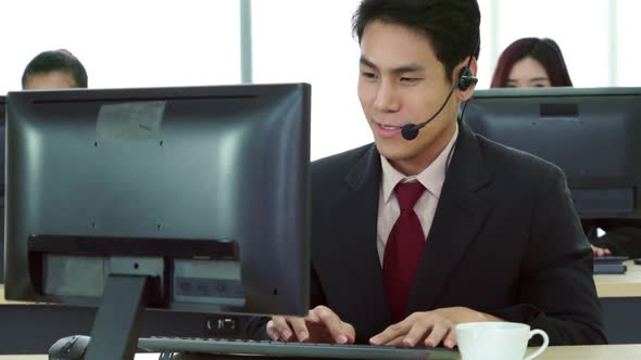 Business People Wearing Headset Working in Office