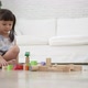 Asian girl playing wood blocks toy - VideoHive Item for Sale