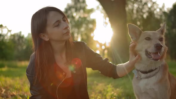 Close-up of Tender Relationship Between the Mistress and Her Dog.