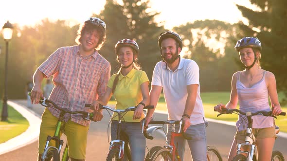 Cheerful Group of Young People with Bicycles