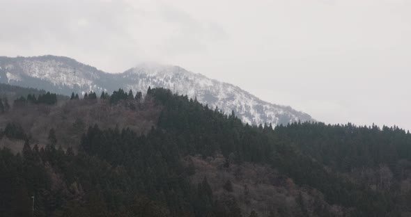 Moving Scenery of Mountains and Forest Seen From Train Window. Beatiful View of Japan Nature