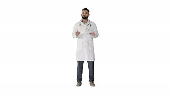 Confident Doctor Talking and Looking Into the Camera on White Background.