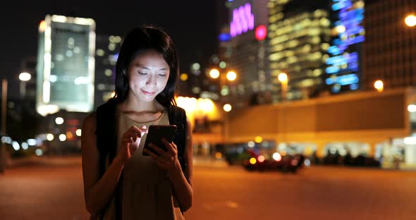 Woman Using Smart Phone at Night 