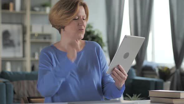 Old Senior Woman Celebrating Success While Using Tablet