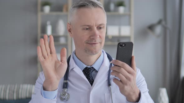 Online Video Chat Via Phone By Senior Doctor