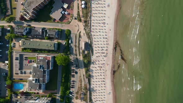 Aerial Birds Eye Overhead Top Down View of Tourist Beach in Scharbeutz Germany Baltic Sea Forward