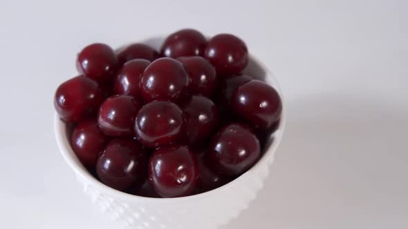 Fresh Cherry on Plate on Wooden White Background