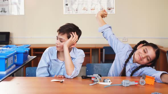 Portrait of Two Schoolchildren Sitting By One Desk