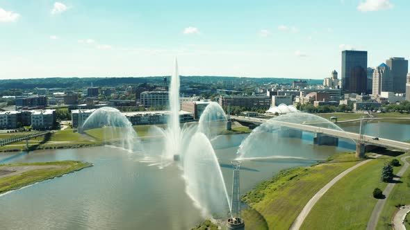 Drone Circling River Fountain Revealing Downtown Dayton Skyline