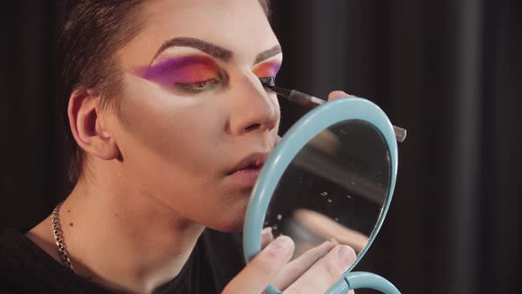 Drag Artist  Young Man Applying Black Eyeliner