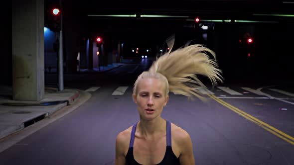 Attractive Woman Jogging Through A Tunnel