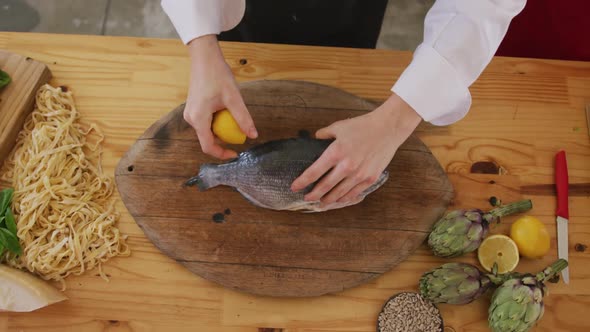 Chef cleaning a fish