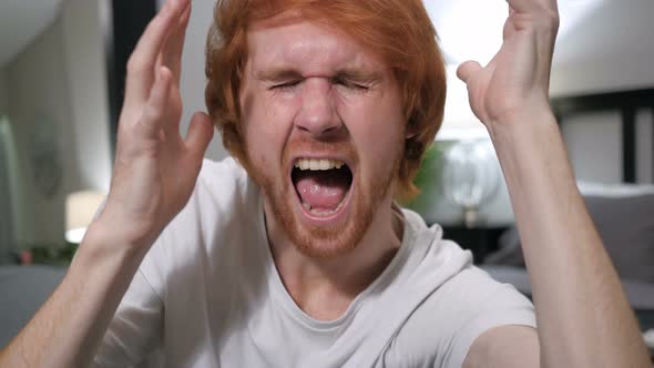 Screaming, Shouting Casually Sitting Redhead Man