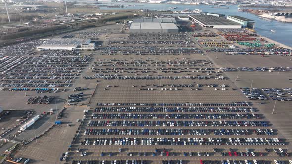 Aerial of a Automotive Car Terminal Parking Lot Storage Loading Area Ready for Distribution in the