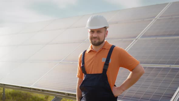 Portrait of Ecological Expert Industrial Worker in Uniform Standing By Solar