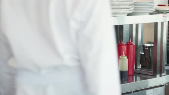 Male Chef in Protective Gloves Decorating His Dish Before Serving at the Restaurant Preparing Brunch