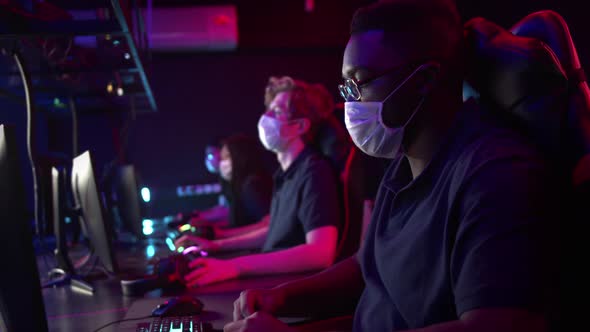 A Difficult Training Day at the Cyber Team Bootcamp is Over the Masked Gamers Take Off Their