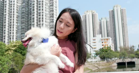 Woman hugging dog at outdoor