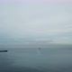 Lowering Shot of Ocean with Ships in Background - VideoHive Item for Sale