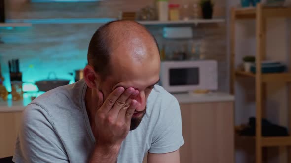 Stressed Man Working Overtime Feels Eye Fatigue