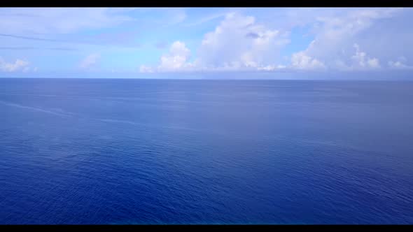 Aerial drone landscape of relaxing island beach trip by aqua blue ocean and white sand background of